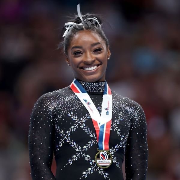 Simone Biles advocates for courage and taking chances, which are crucial for pushing limits and fostering grit and resilience.